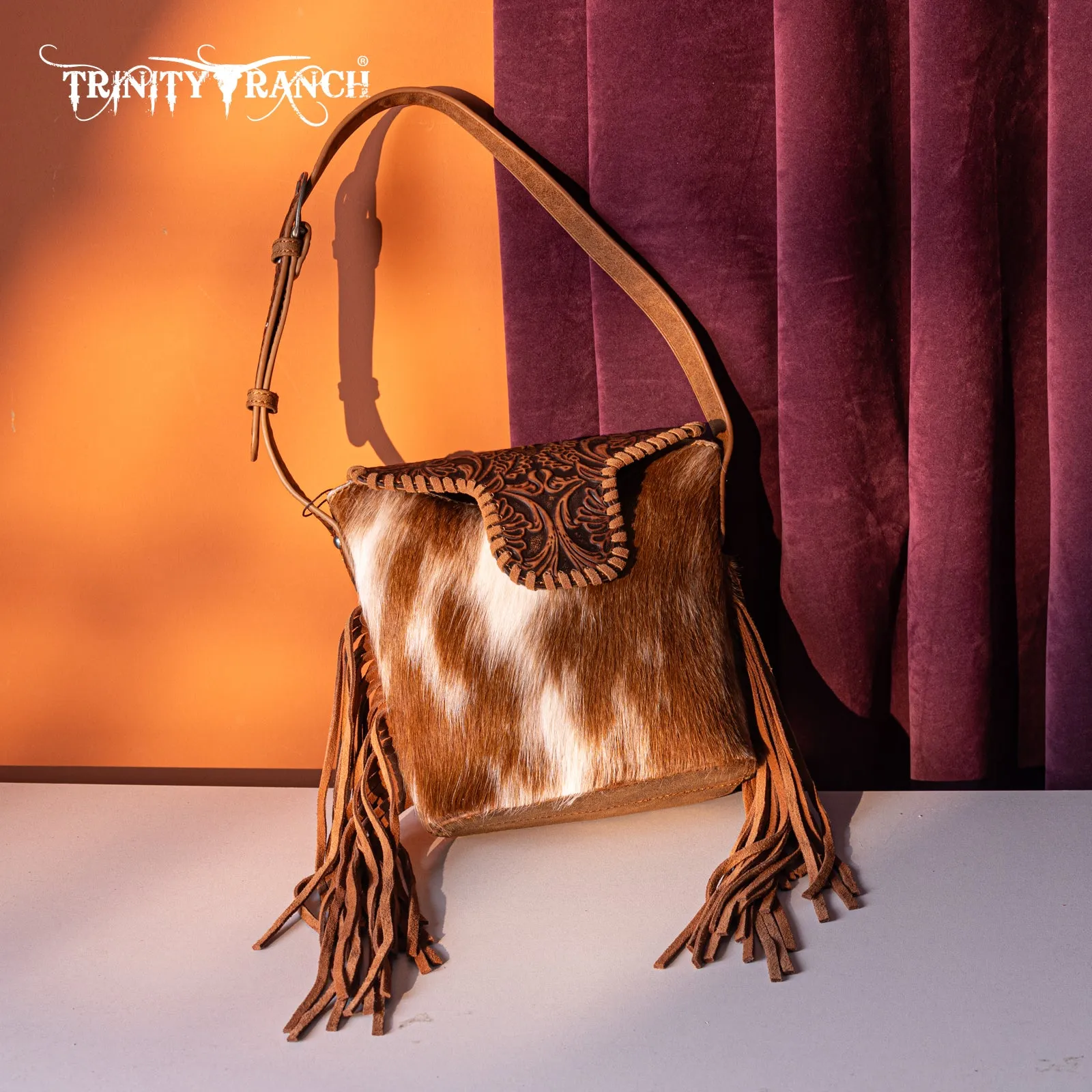 TR182-9181  Trinity Ranch Genuine Hair-On Cowhide Tooled Fringe Shoulder Bag-Brown